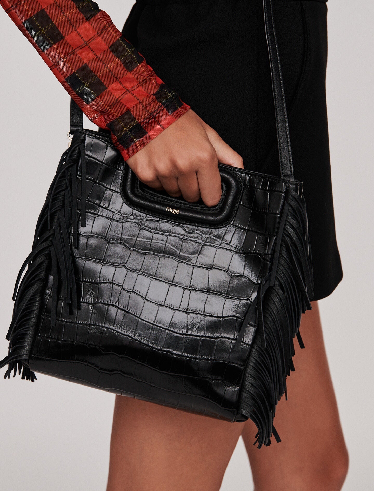 Black-fringed leather m bag