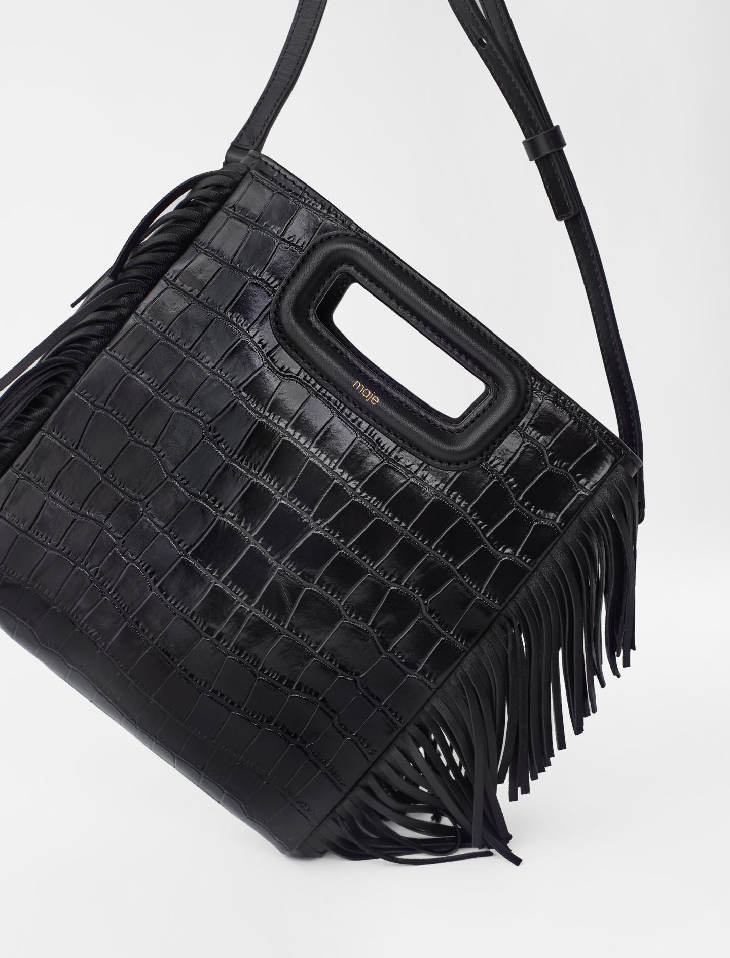 Black-fringed leather m bag