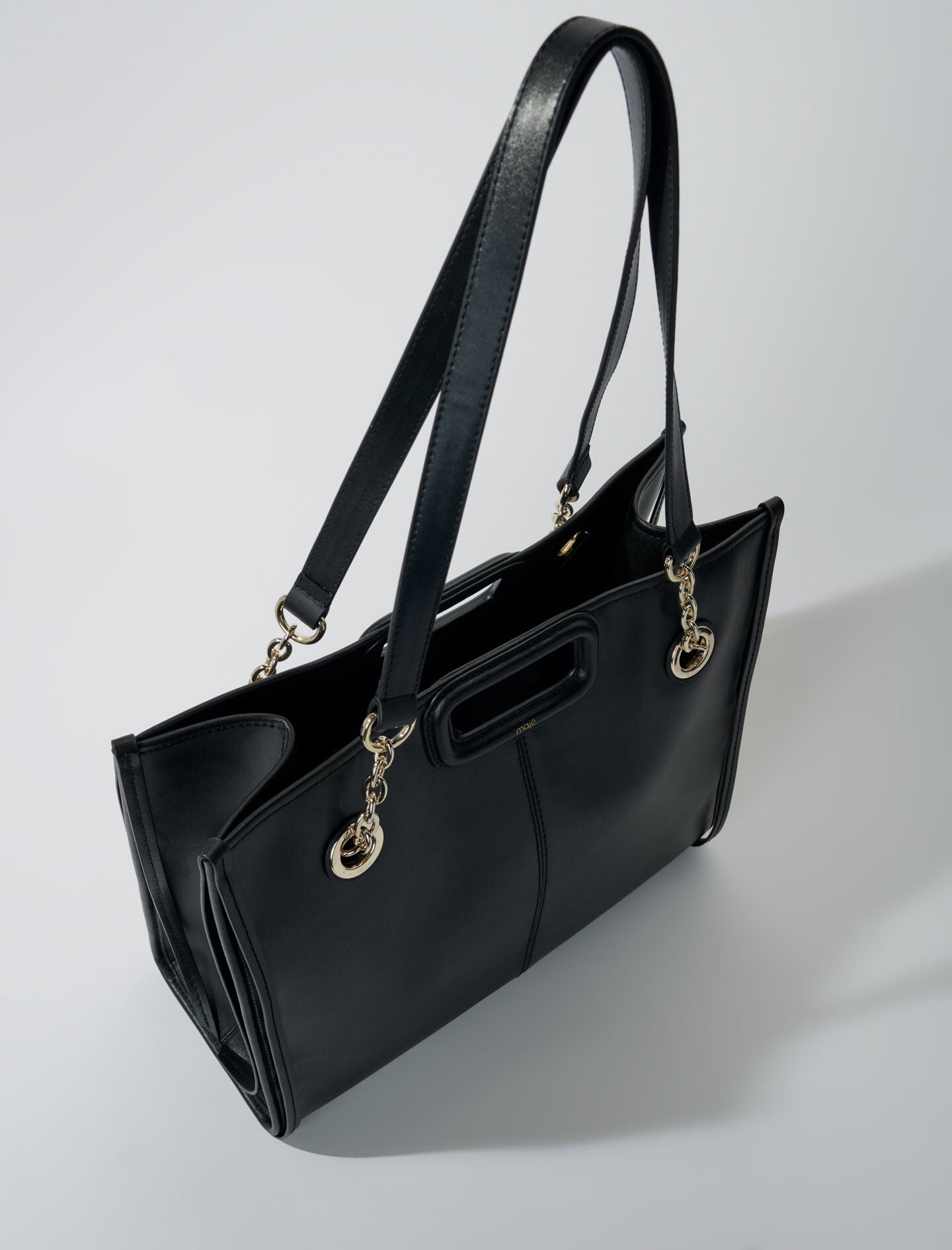 Black-fringed leather tote bag