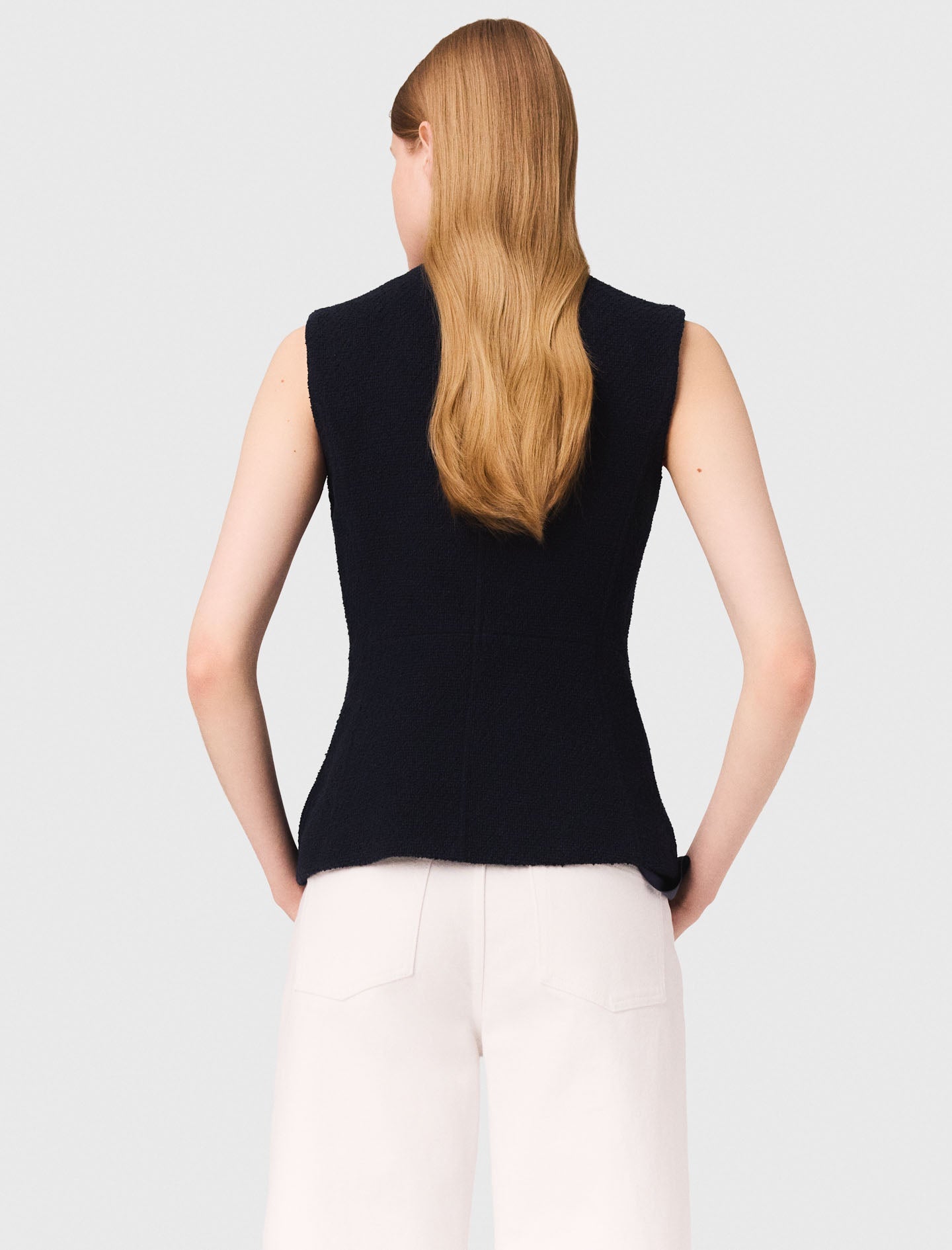 Long sleeveless tweed jacket