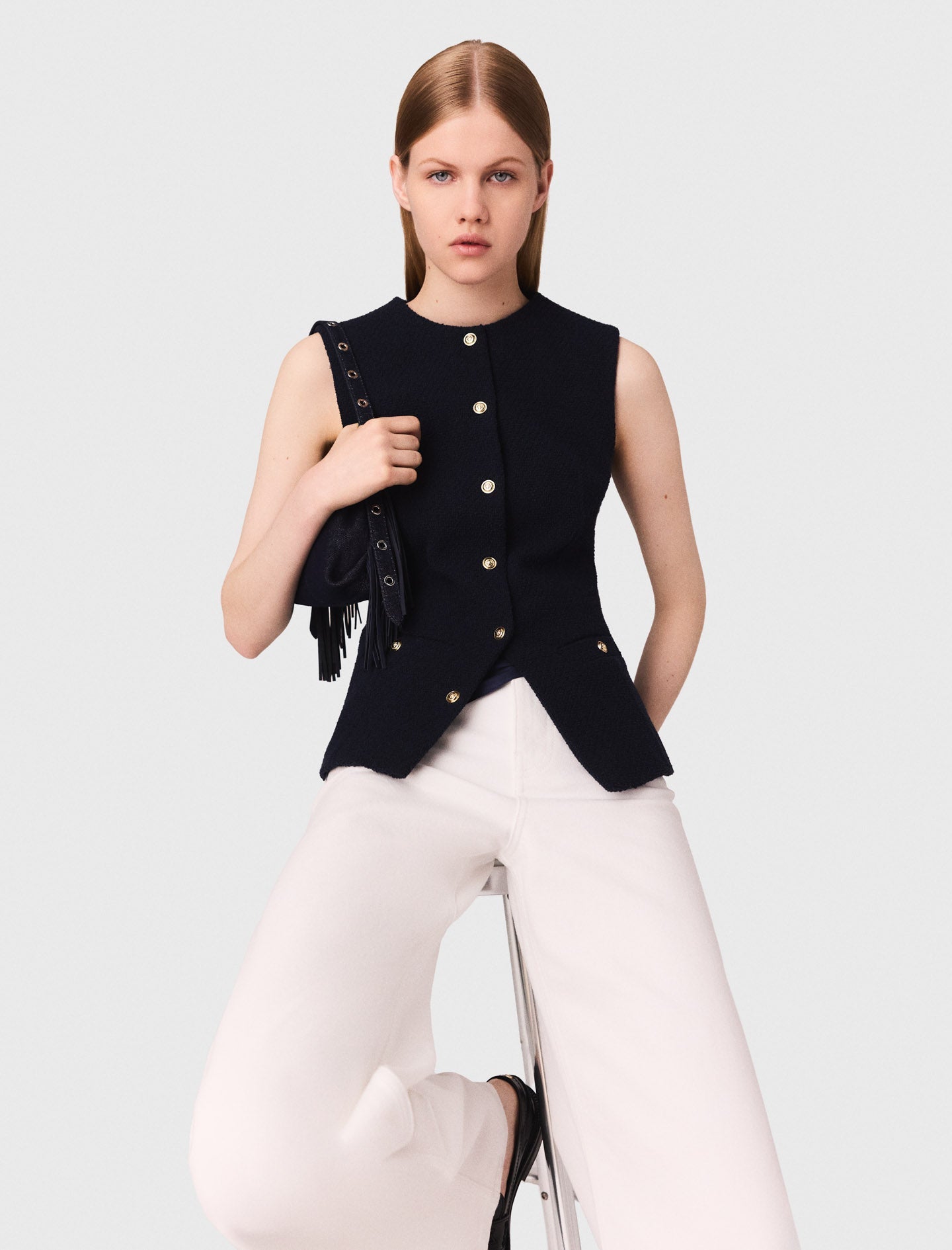 Long sleeveless tweed jacket