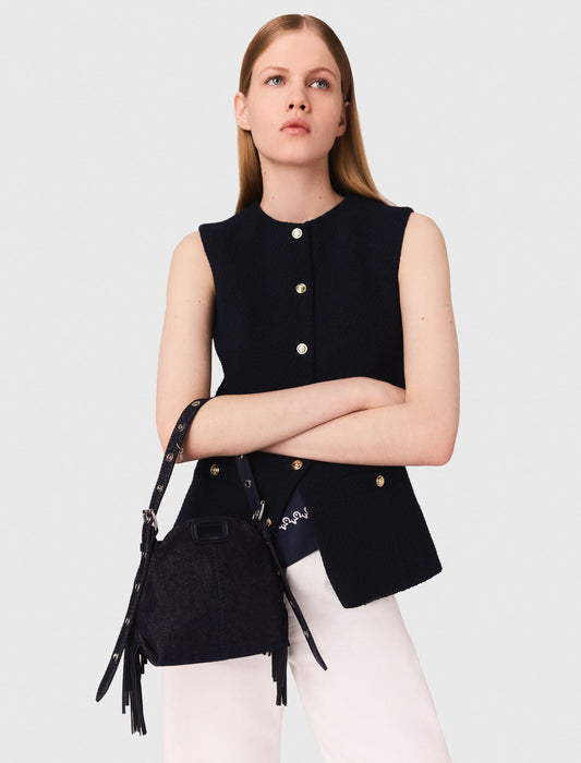 Long sleeveless tweed jacket